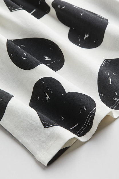 BLACK HEART ALLOVER PRINT SLEEVELESS FROCK